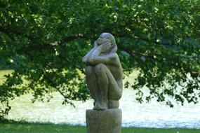 sculpture of a girl in the park
