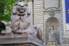 stone lions with white elephant background