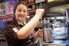 smiling barista at work