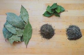 dried basil leaves with spices on the table