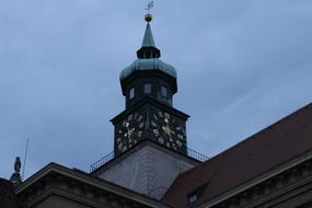 clock tower against the clouds