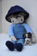 Beautiful and cute amigurumi of doll, with the dog