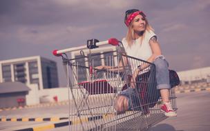 fashion girl in shopping trolley
