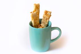 pickle sticks snack in a blue cup