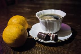 Sweet coffee with candy and lemon