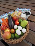 Raw vegetables on a plate with cheese and meat snacks