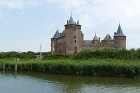 an old castle with green trees