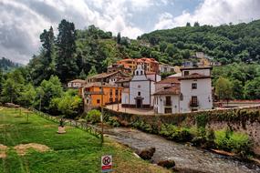 brick house with trees on a hill