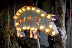 colored sign in the form of a pig with lanterns