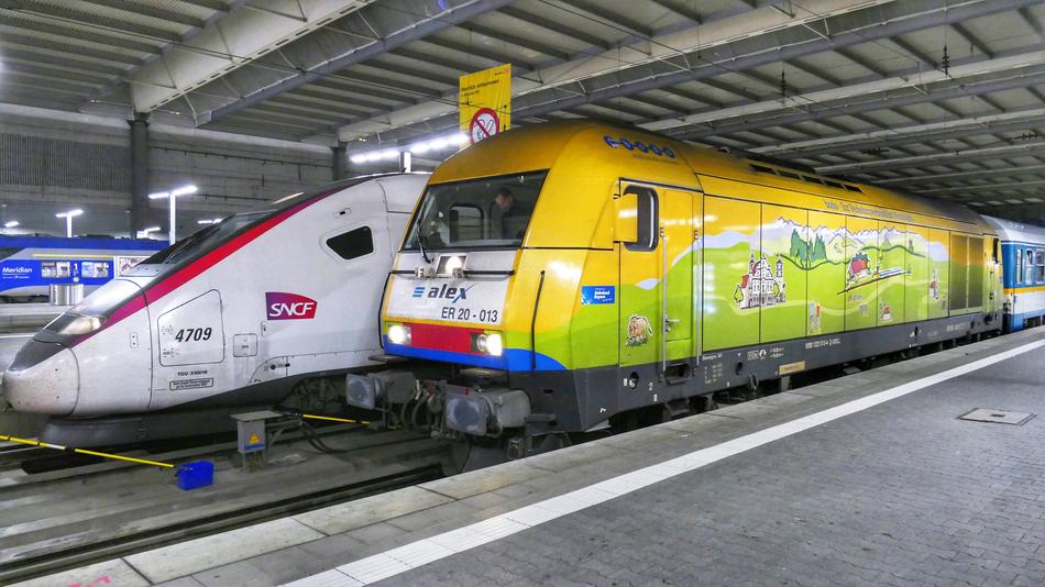 Colorful, shiny trains on the railway with lights