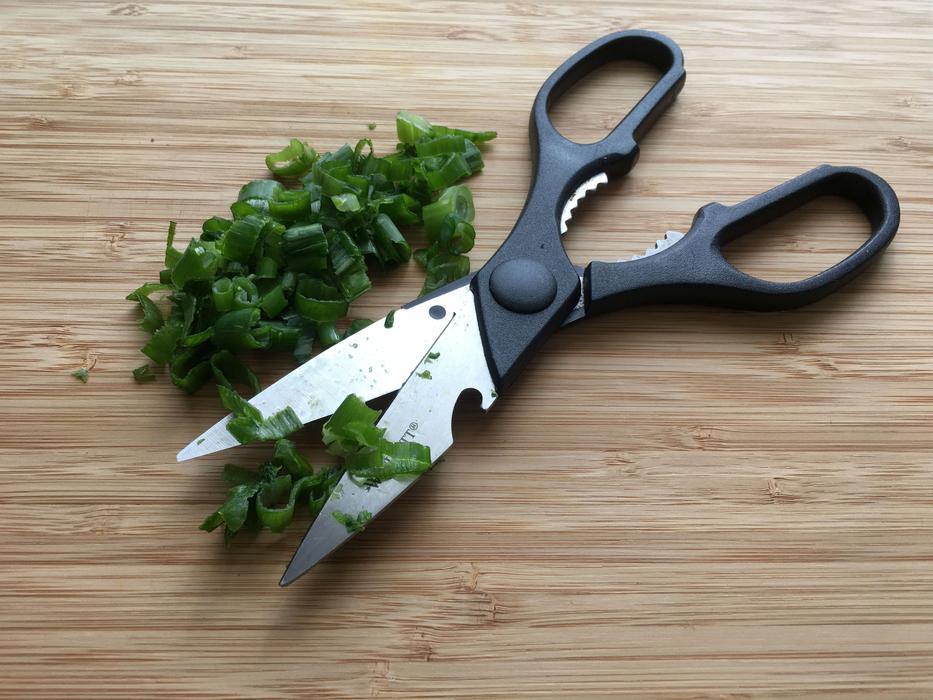scissors lying on sliced onions