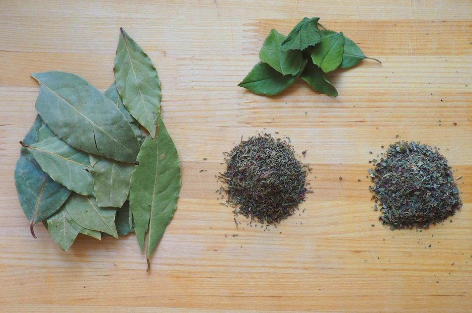 dried basil leaves with spices on the table