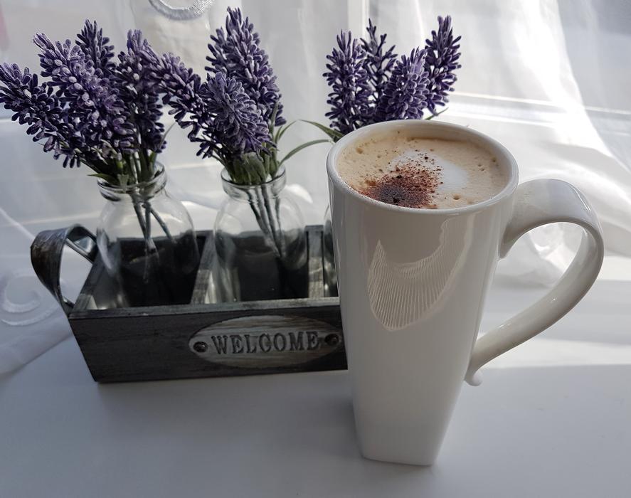 sweet coffee on a table with flowers