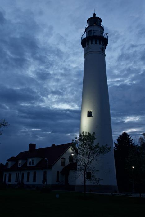 white lighthouse in stormy weather