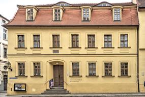 yellow big house on the street