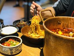 noodles in a wooden plate