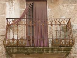 balcony with red curtains