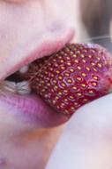 enjoying strawberries