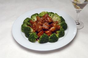 Boiled broccoli with meat in sauce