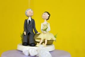 a couple of people in a yellow background