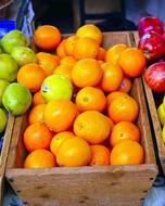 ripe orange in a wooden box