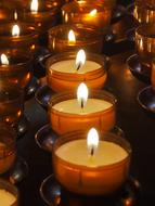 burning night candles in the temple