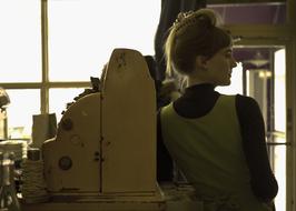 girl standing by the cash register