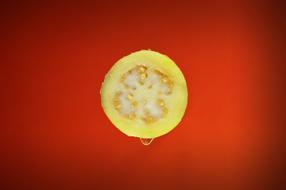 piece of yellow fruit in water