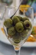 green olives in a clear glass