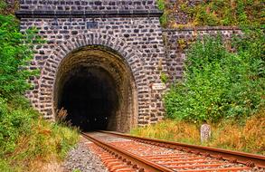 tunnel into the darkness of the rails