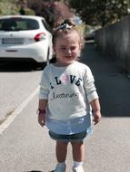 crying girl in denim skirt on the street