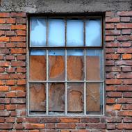 red brick house with a window