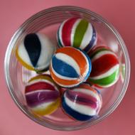 colored round candies in a plate