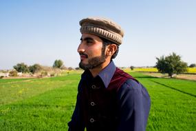 farmer on a field in the mountains