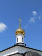 white house with a golden roof