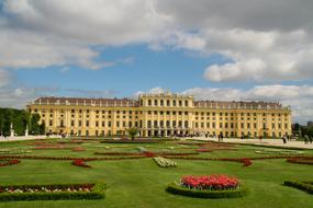 a green garden with a state house