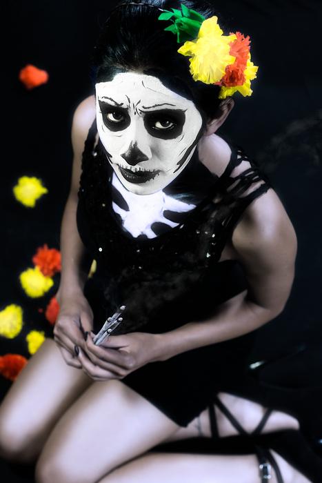 a girl with flowers in her head and a white face