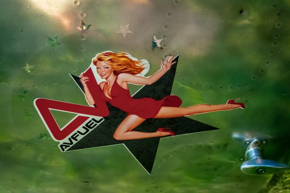 a girl in a red dress with a green star