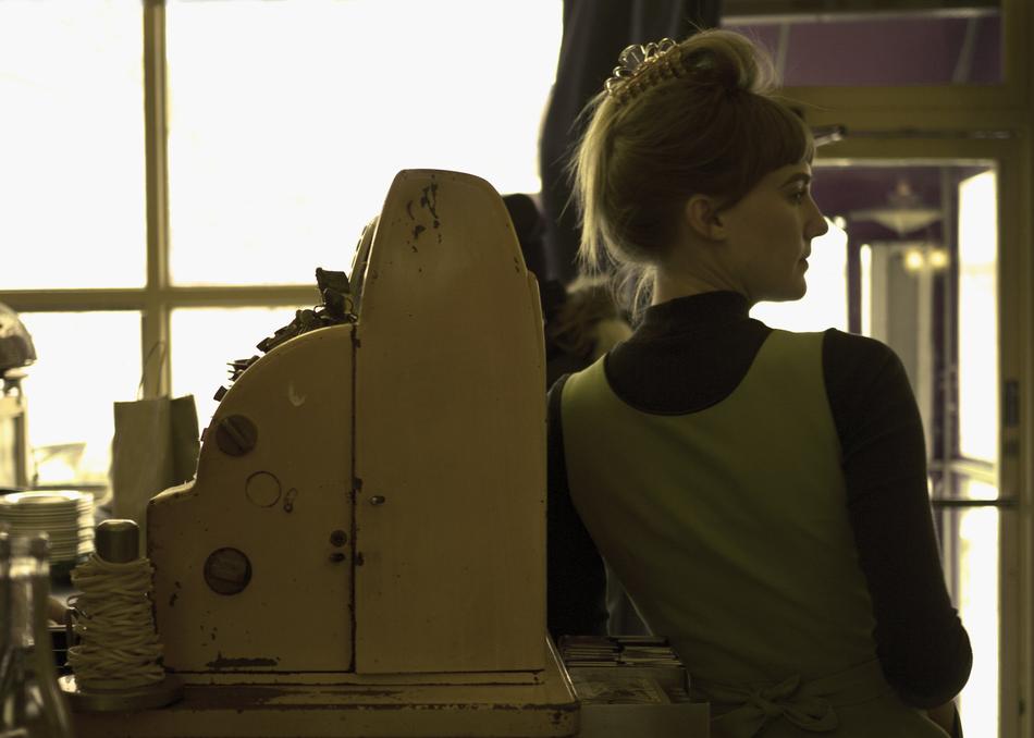 girl standing by the cash register