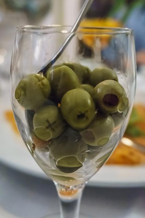 green olives in a clear glass