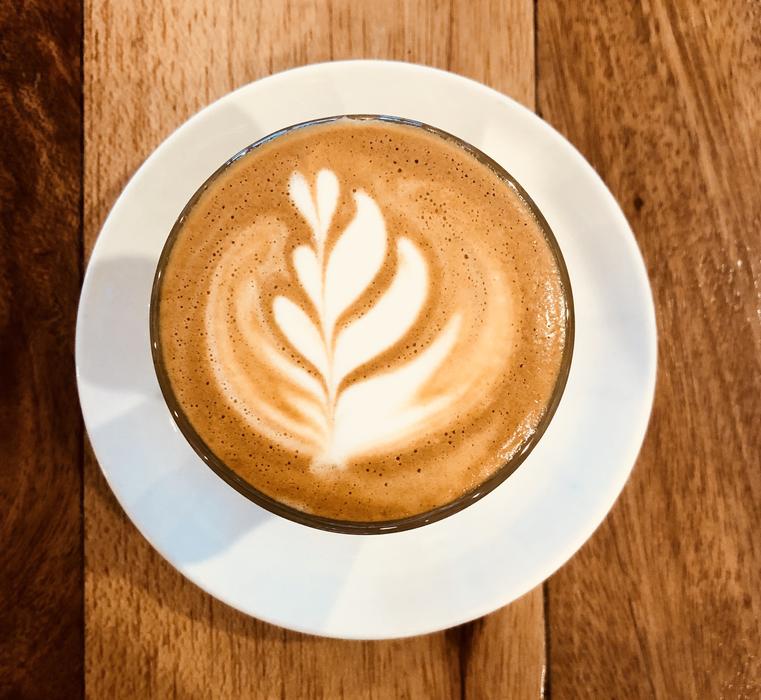 hot foam coffee with leaf pattern