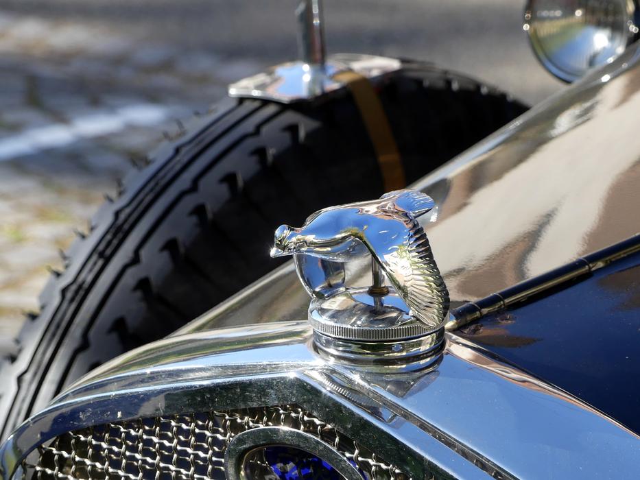 silver car in black background