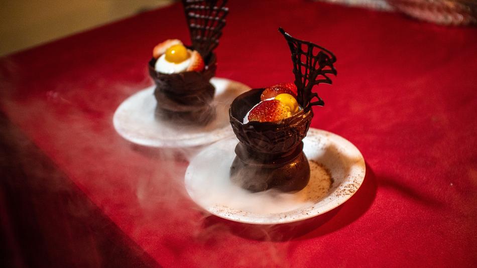 Hot chocolate dessert with fruit in a plate
