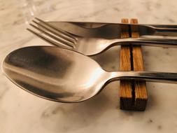 iron spoon with fork and knife