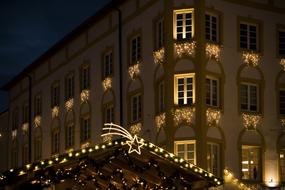 golden star and garlands on the roof of the house