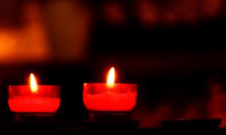 red candles at night in the temple