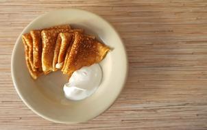 fried pancakes with sour cream