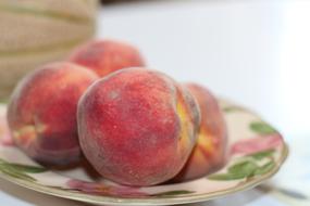 juicy delicious peach in a bowl