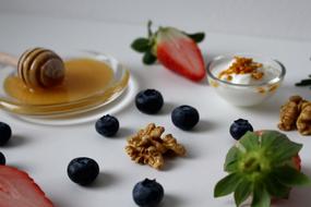 Sweet honey and nuts and fruit on the table