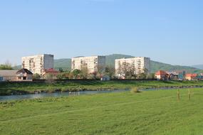 modern neighborhood with green meadow